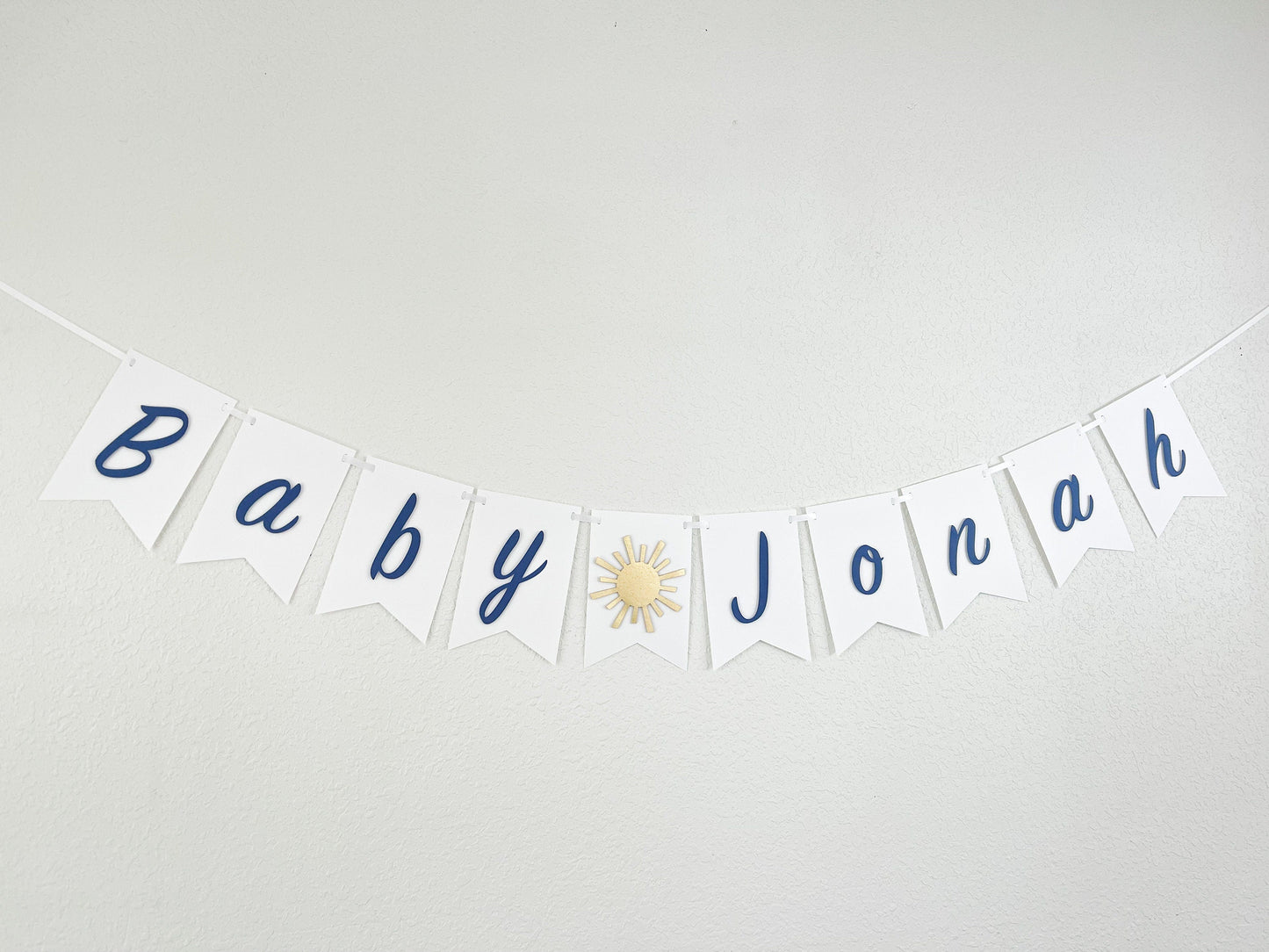 blue and gold sunshine banner for baby boy’s first birthday