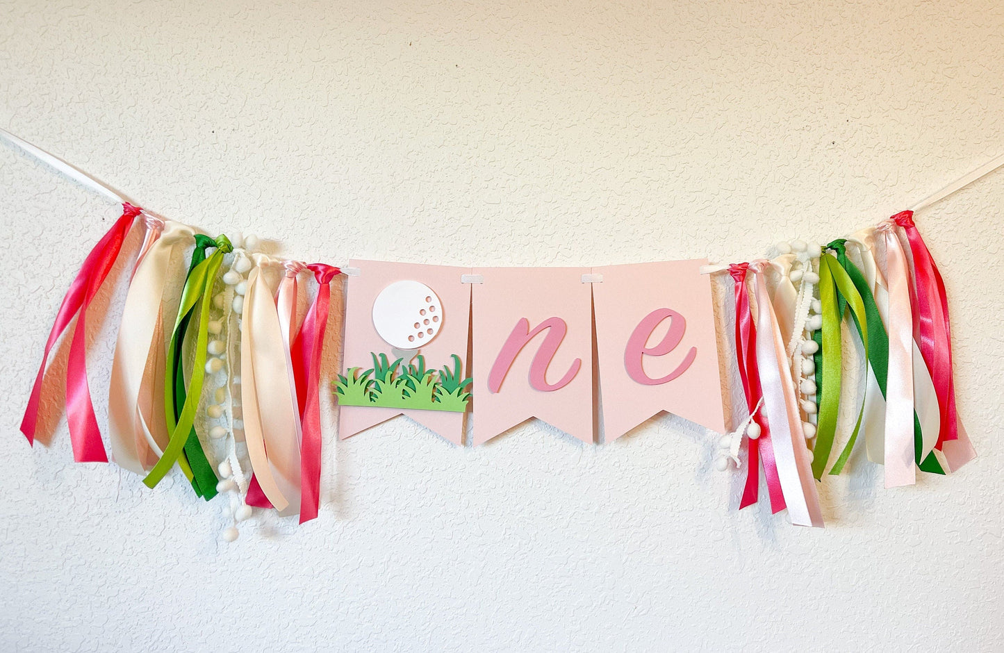 Pink golf themed ONE banner for girl’s first birthday