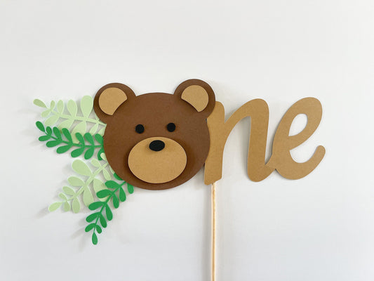 teddy bear first birthday cake topper with the word One