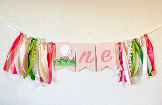 Pink golf themed ONE banner for girl’s first birthday