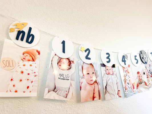 Outer space themed monthly photo banner for first birthday